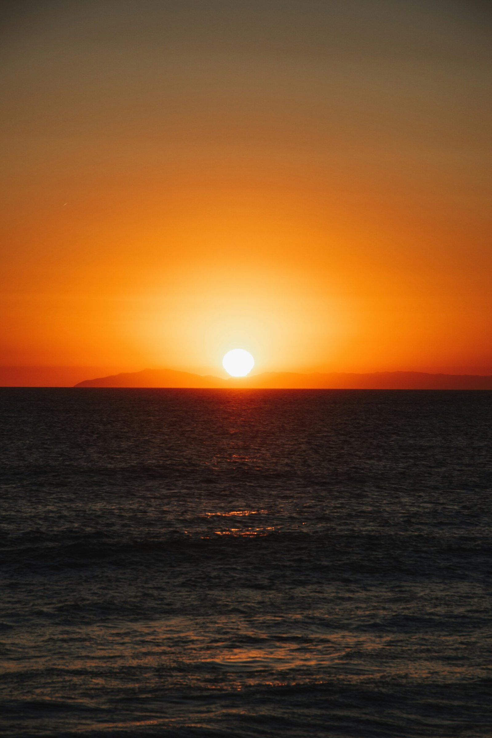 body of water during sunset